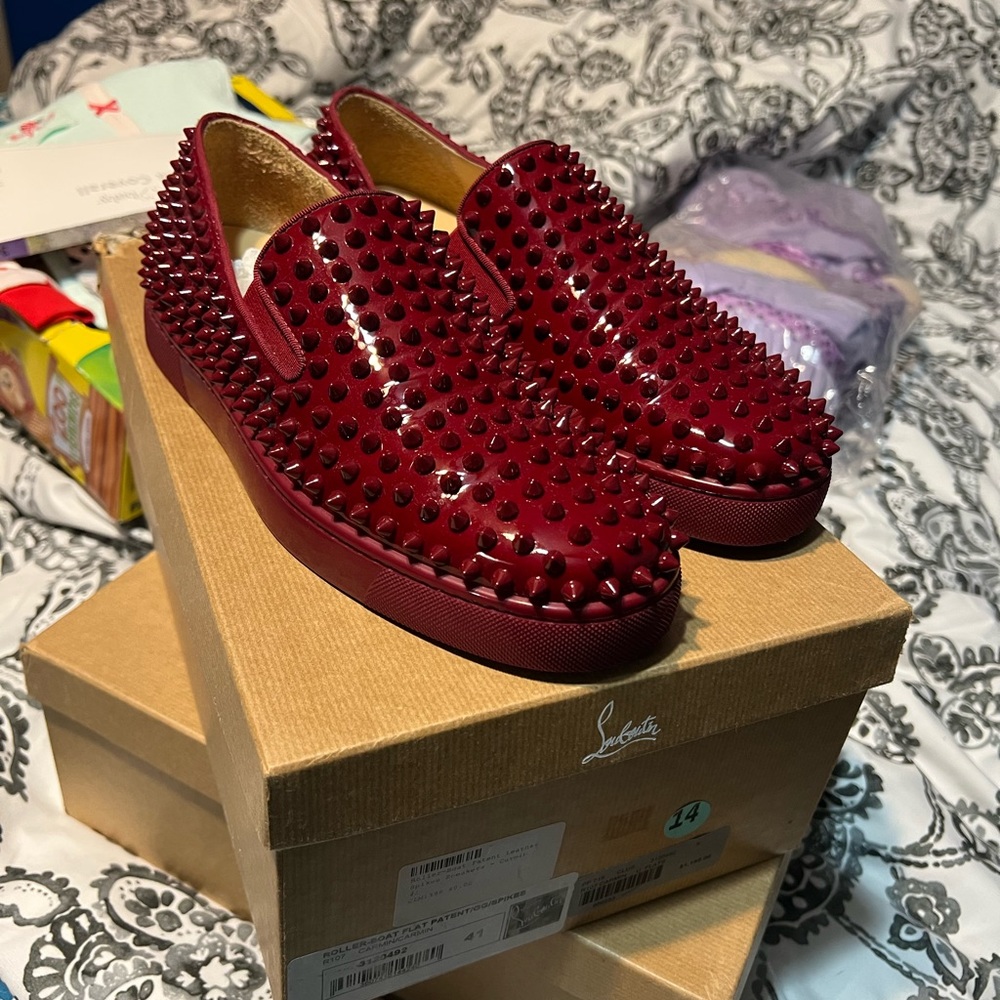 Christian Louboutin red bottom slip on